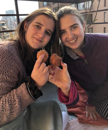 Nelia and her sister with donuts